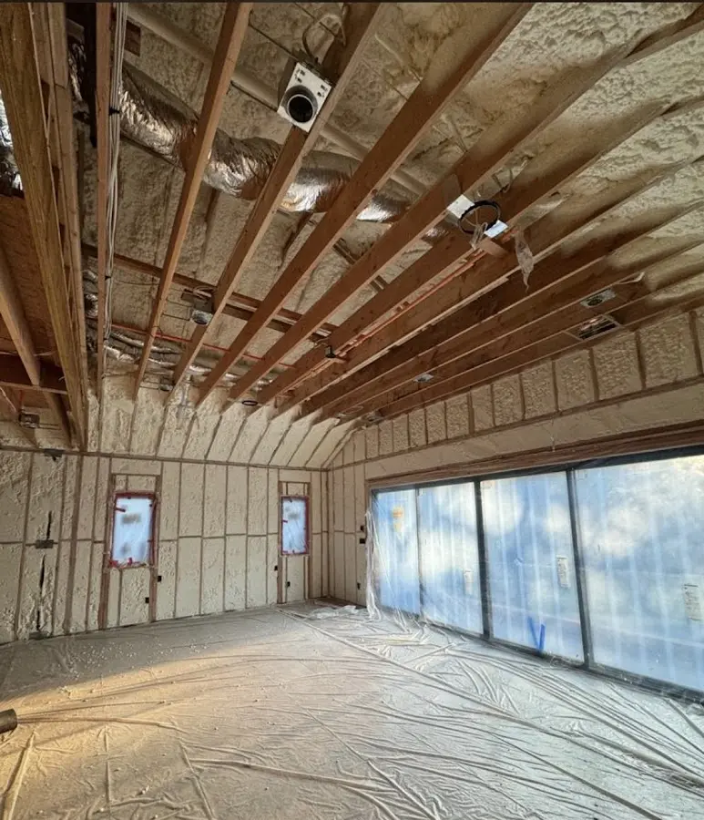 Interior walls and ceiling insulated with spray foam during new construction in Daytona Beach